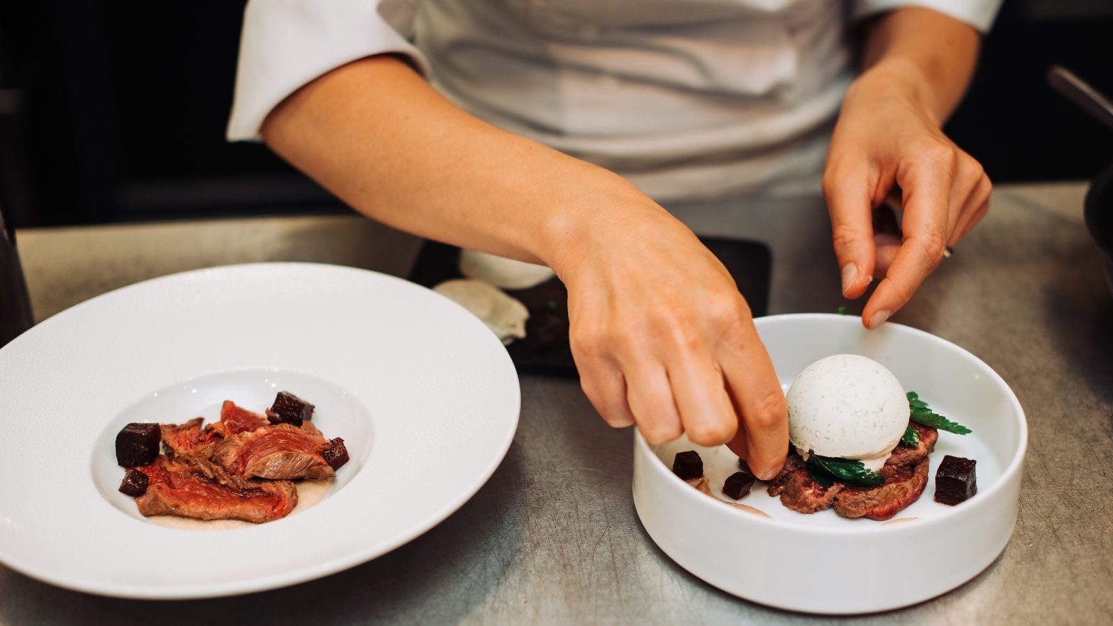 Michelin chef serving food for guests, french cuisine, close up, crop on hands