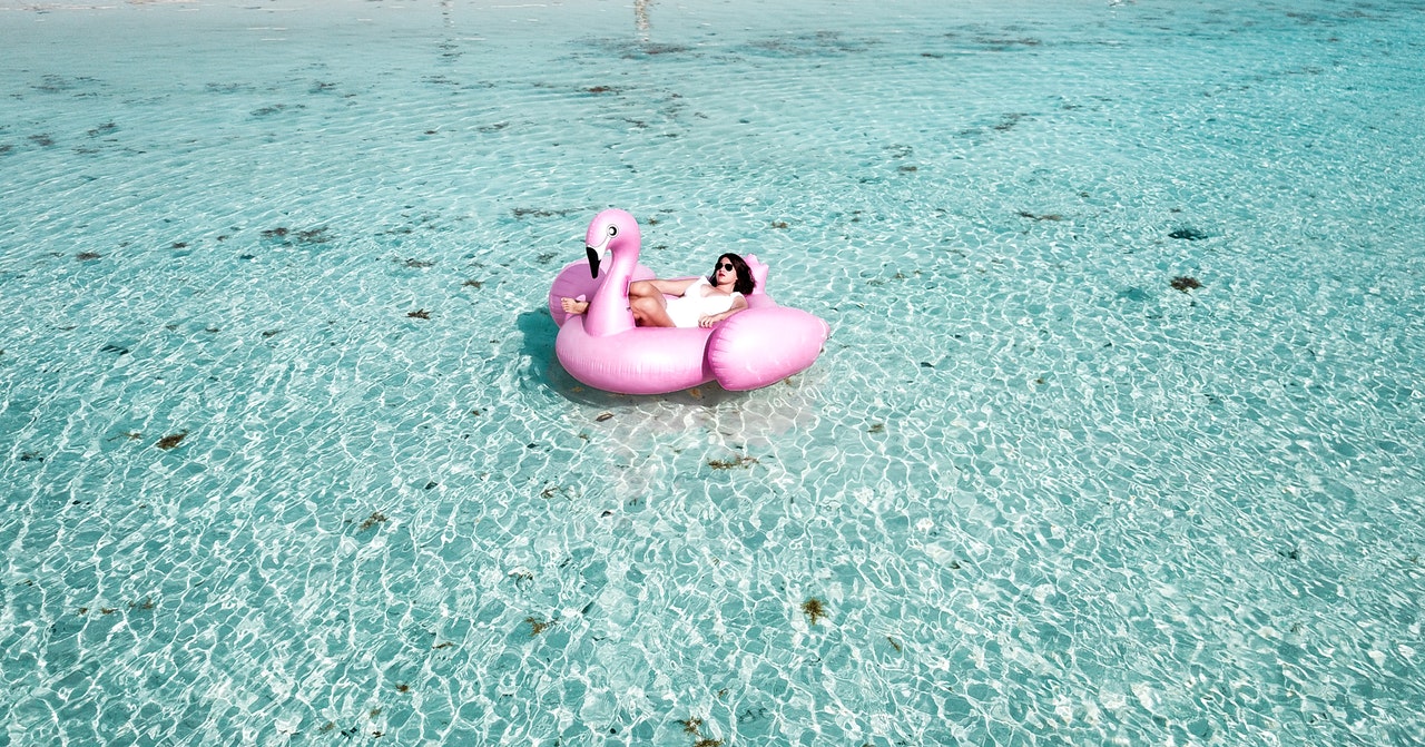woman on pink flamingo